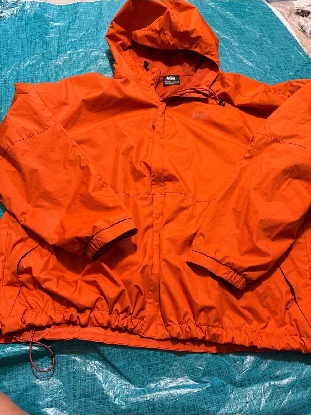 REI Men’s Bright Orange Hooded Rain Jacket